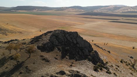 Elevated-Rocky-Terrain-Over-Plains-On-Remote-Nature-Landscape