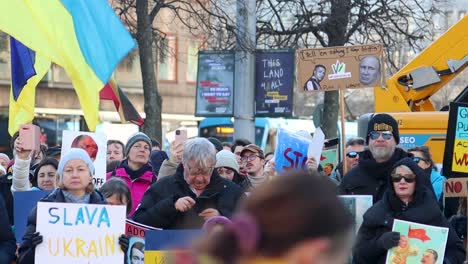 Slomo-of-protest-against-Russian-war-in-Ukraine,-tram-in-background