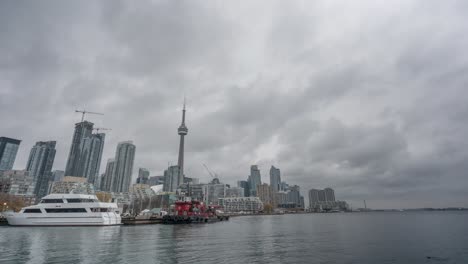 Timelapse-of-clouds-over-CN-Tower,-skyline-and-Harbourfront-in-Toronto