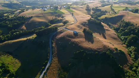 Scenic-Chilean-Green-Mountainscape-With-Hillside-Roads,-4K-Aerial-Drone,-Chile-Chiloe
