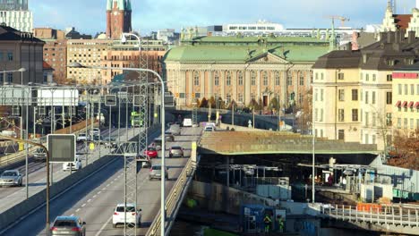 Car-traffic-on-bridge-and-buildings-in-evening-sunlight-in-Stockholm