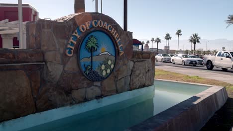 City-of-Coachella,-California-sign-with-cars-in-the-background-and-stable-video