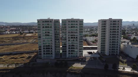 Aerial-approaching-shot-of-modern-residential-area-blocks-in-suburb-of-Puebla-City