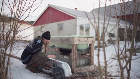 A-Man-is-Installing-a-Vent-For-the-DIY-Hot-Tub---Static-Shot