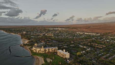 Kihei-Maui-Hawaii-Aerial-v1-panoramic-panning-views-drone-flyover-Keaka-beach-capturing-coastal-landscape,-island-townscape-and-Haleakala-volcano-at-sunset---Shot-with-Mavic-3-Cine---December-2022
