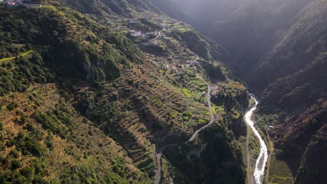 Drone-flight-over-beautiful-nature-and-a-small-village-in-Madeira,-Portugal