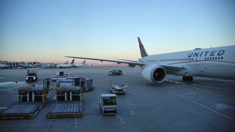 A-United-Airlines-Boeing-777-Parked-at-the-Gate,-View-from-Terminal
