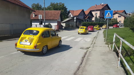 Fiat-500-Oldtimer-Cars-in-Parade,-Procession-of-Small-Vintage-Italian-Cars