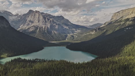 Emerald-Lake-BC-Canada-Aerial-v6-nature-landscape-views-of-lake,-coniferous-forest-valley,-and-majestic-mountain-ranges-at-Yoho-National-Park-in-the-summer---Shot-with-Mavic-3-Pro-Cine---July-2023