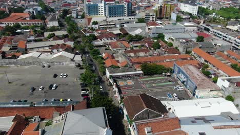 Rooftops-and-streets-of-Semarang-cityscape,-aerial-drone-view