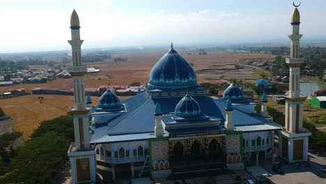 Aerial-rising-above-the-Islamic-Center-Dato-Tiro-Bulukumba-mosque-and-school-for-Islamic-education-in-South-Sulawesi,-Indonesia