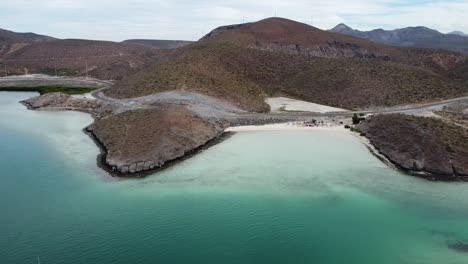 Playa-Balandra-beach-and-panoramic-road-along-Baja-California-Sur-peninsula,-Mexico