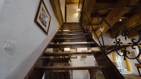 Living-room-with-wood-stairs-leading-up-to-second-floor-in-modern-home