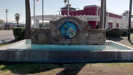 City-of-Coachella,-California-sign-with-gimbal-video-walking-forward