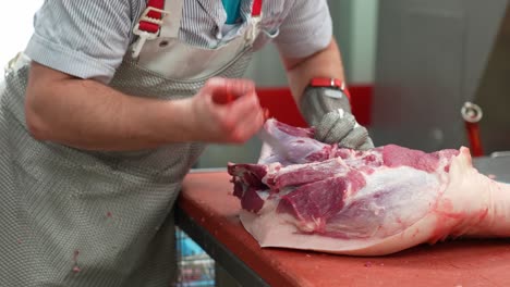 Butcher-making-abattoir-and-slaughterhouse-operations-and-cutting-pork