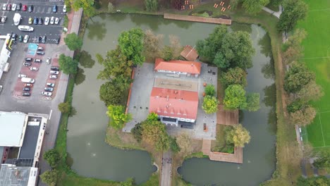 town-hall-surrounded-by-moat-aerial-tilt-high-angle