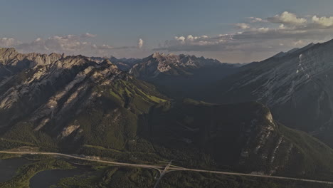 Banff-AB-Canada-Aerial-v29-high-flyover-forested-valley-capturing-pristine-landscape-of-Cascade-and-Norquay-mountain-ranges-and-Trans-Canada-highway-route---Shot-with-Mavic-3-Pro-Cine---July-2023