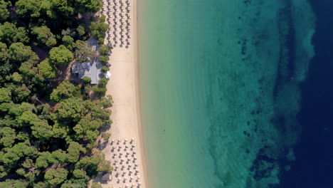 Aerial:-Top-down-shot-of-tropical-koukounaries-beach-at-southern-Skiathos-island,-Greece
