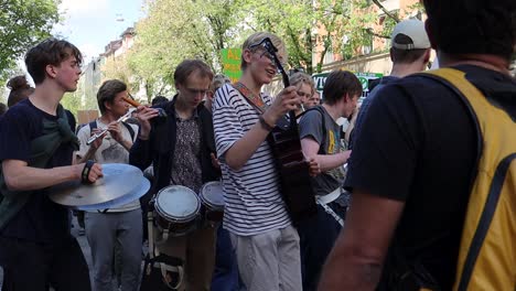 Young-musicians-play-instruments-at-climate-protest-march-in-Sweden