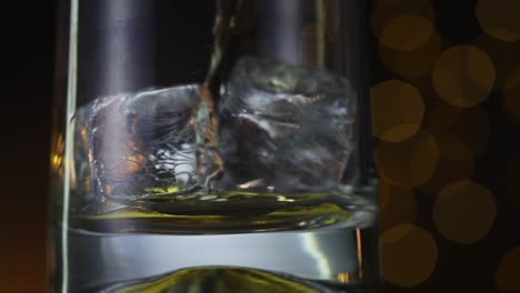 Whisky-poured-over-ice-cubes