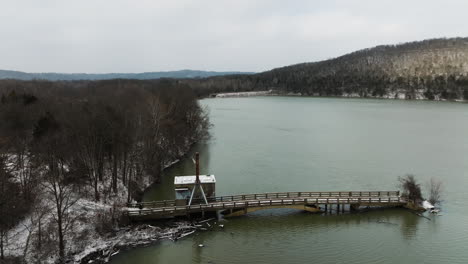 Old-Bridge-And-Pier-With-Crane-In-Lake-Sequoyah-During-Winter-In-Arkansas