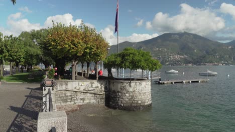 People-Enjoying-Afternoon-Sun-in-Town-of-Menaggio-in-Italy