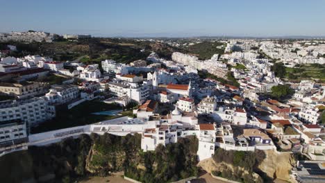 Aerial-view-of-Albufeira’s-white-washed-cityscape,-Algarve-Portugal