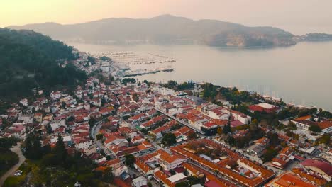 Aerial-view-at-sunset-of-Fethiye-Turkey-southwestern-Turquoise-Coast-port-city-seascape-travel-holiday-destination-drone-footage