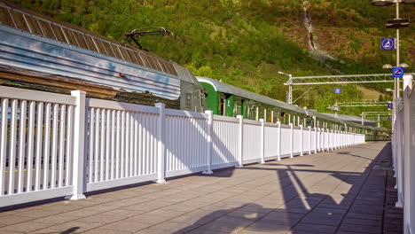 Flam-Railway-Station's-platform-time-lapse,-bustling-with-travelers-with-Norway's-scenic-backdrop