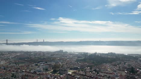 The-Tagus-river-in-the-early-morning-flowing-through-the-capital-city-of-Lisbon,-Portugal