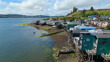 Aerial-Panoramic-Sea-Coast-Drone-above-Castro-stilt-houses-Chilean-Patagonia-Sky-Islet-Landscape-in-Summer-Daylight,-South-American-Chiloé-Travel