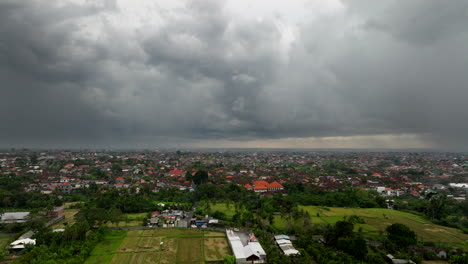 Flying-over-Bali-in-Indonesia-with-rice-fields-and-stormy-sky-in-background