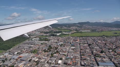 Passenger-Jet-Landing,-View-from-Cabin-of-Flying-Airplane-Wing