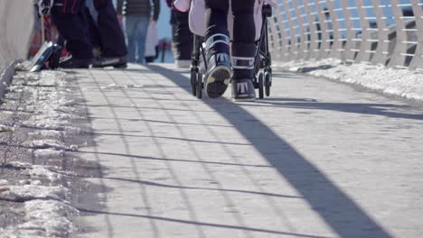 Pushing-a-stroller-across-a-pedestrian-bridge