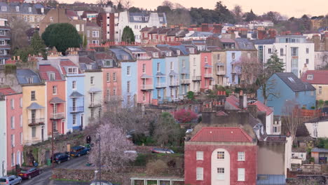 Telephoto-drone-view-of-colourful-Hotwells-houses-on-hillside-Clifton,-Bristol