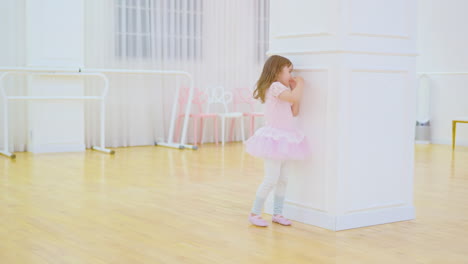 Little-Child-Ballerina-Playing-Posing-Game-With-Teacher-After-Ballet-Studio-Class,-Smiling---Slow-motion