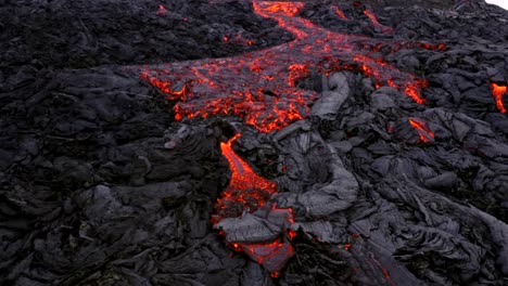 A-4K-drone-provides-an-aerial-cinematic-bird's-eye-view-of-both-active-and-inactive-lava-flows