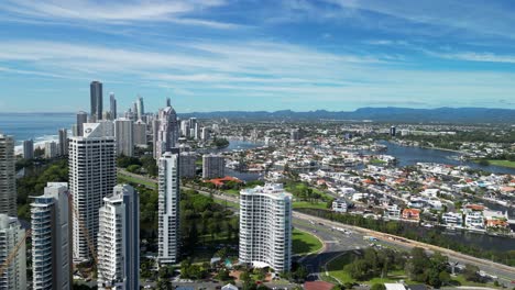 Aerial-view-of-Main-Beach-and-Paradise-Waters-overlooking-the-iconic-Gold-Coast-skyline-and-hinterland