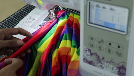 Making-clothes-with-rainbow-fabric-by-sewing-it