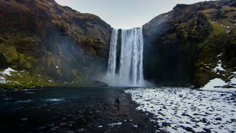 A-4K-drone,-cinematic-and-dramatic-shots-of-Kirkjufell-waterfall-from-the-ground-level-showcasing-the-panoramic-view-of-the-area