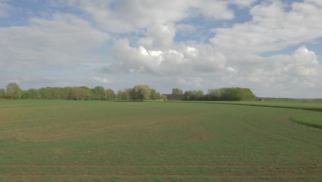 Fields-landscape,-filmed-out-of-train-window