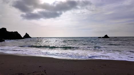 slow-motion-early-morning-colours-waves-on-sandy-beach-Waterford-Ireland-on-a-spring-morning