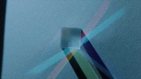 Top-shot-of-refracting-colored-cubes-with-a-blue-base