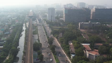 Aerial-Drone-Shot-Of-Misty-Sunrise-Near-Taramani-Chennai-City-Filled-With-Buildings