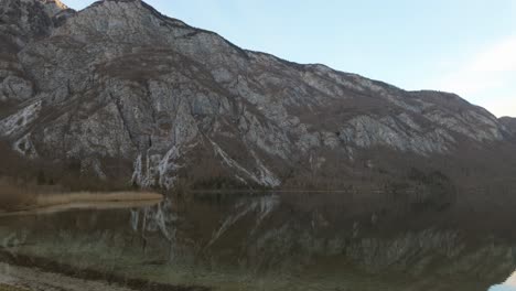 Lake-Bohinj-during-winter-time-with-the-surrounding-snowless-Mount-Triglav-in-the-background,-Slovenia