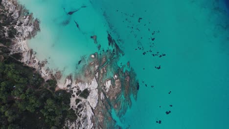 Top-down-aerial-view-of-the-Kavourotripes-and-Portokali-beach-in-Sithonia,-Chalkidiki,-Greece