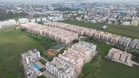 Aerial-Shot-of-Identical-Buildings-Near-A-Highway