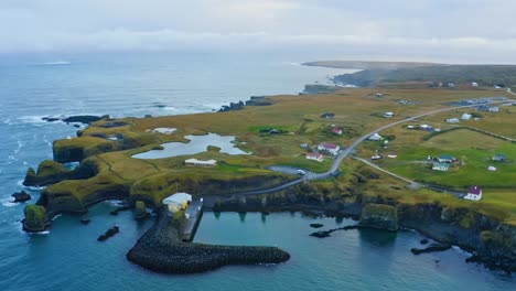 A-stunning-landscape-of-Diamond-Beach-in-Iceland-showcasing-its-landscape-and-housing-community-nearby