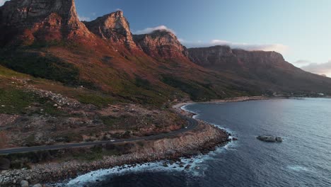Twelve-Apostles-And-Victoria-Road-In-Cape-Town,-South-Africa---Aerial-Shot