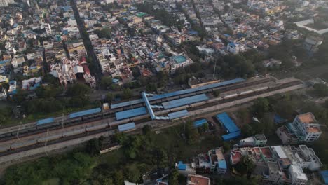 Aerial-Drone-Shot-of-Railway-Station-In-Pondicherry,-India,-Filled-with-Buildings